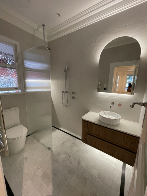 Completed Bellevue Hill bathroom with marble floor and custom timber vanity